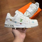 a Louis Vuitton Trainer Low ‘#54 Signature – White Marine’ sneaker.